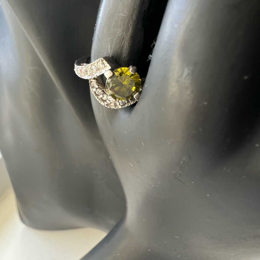 Size 4 silver greenish Color stone ring .